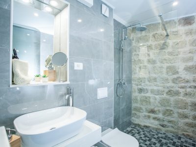 Ensuite bathroom with walk-in shower in First floor studio apartment