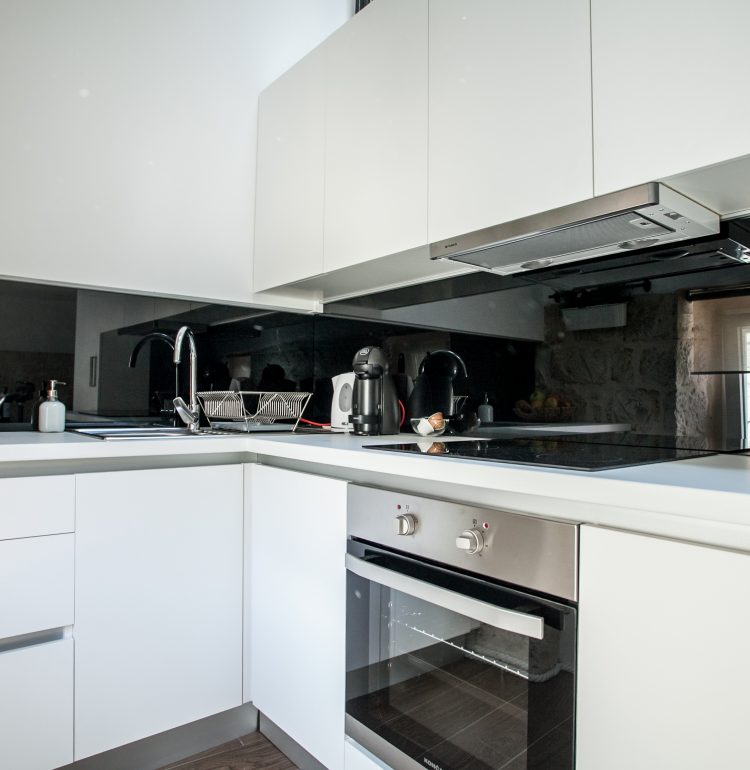 Full kitchen in Vivid flat with lofted bedroom