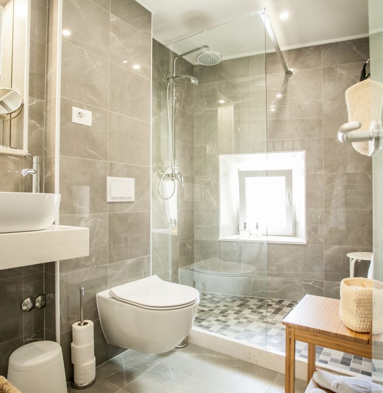 Ensuite bathroom with walk-in shower in Vivid flat with lofted bedroom